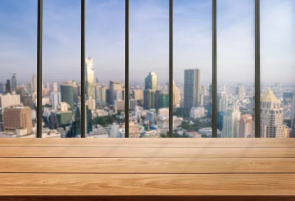 Wooden table in city center, modern office background with copy space