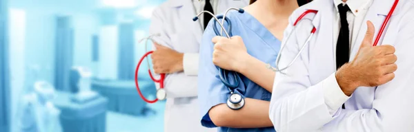 Doctor working in hospital with other doctors. — Stock Photo, Image