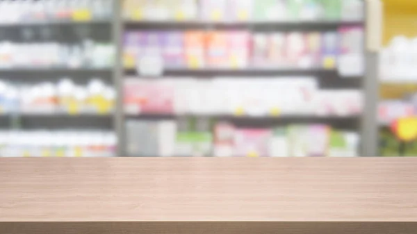 Wood table in pharmacy or drugstore background.