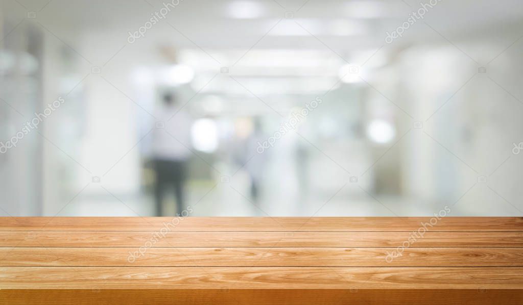 Wood table in modern hospital building interior.