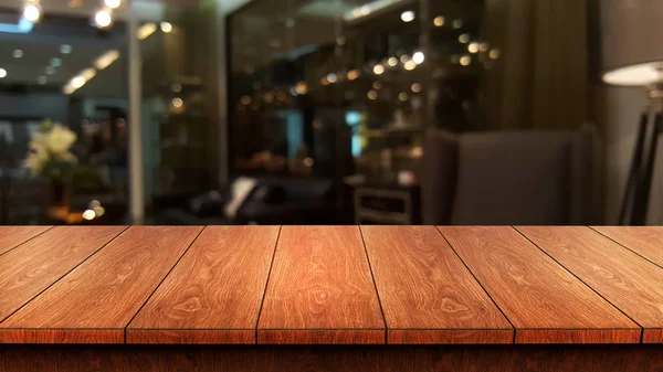 Wood table in blur background of modern restaurant — Stock Photo, Image