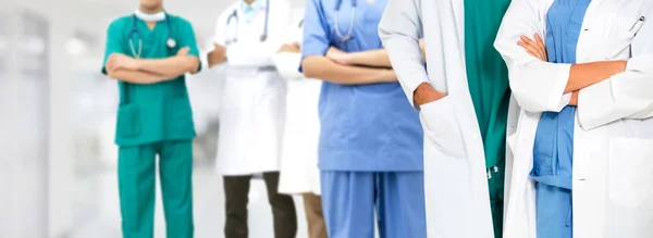 Doctor working in hospital with other doctors. — Stock Photo, Image