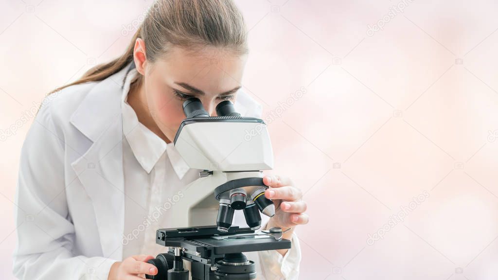 Scientist researcher uses microscope in laboratory