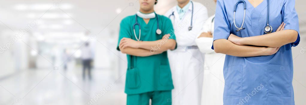 General practitioner doctor, surgical doctor and nurse standing in hospital office.
