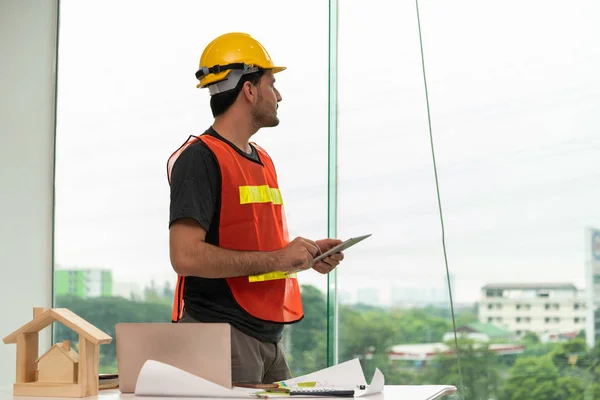 Construction engineer worker working in office.