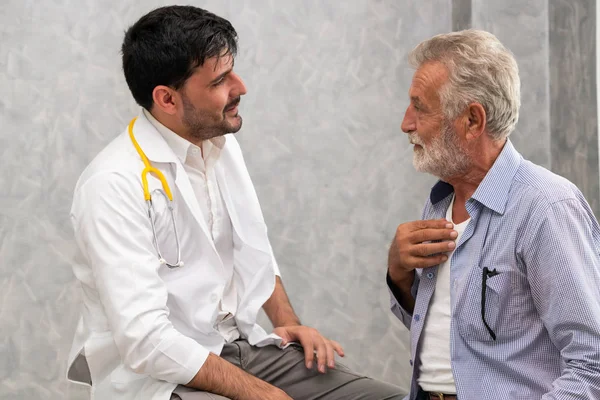 Senior patient visits doctor at the hospital.