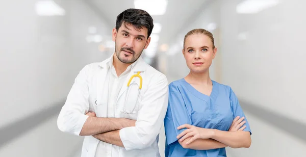 Doctors at hospital working with another doctor. — Stock Photo, Image