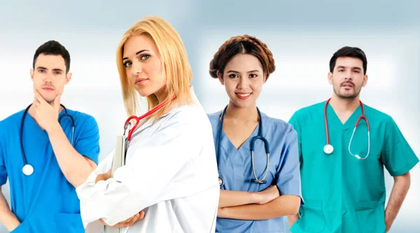 Doctor working in hospital with other doctors. — Stock Photo, Image