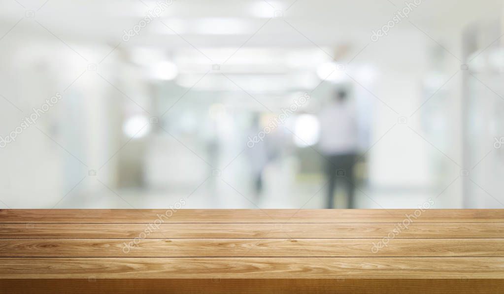 Wood table in modern hospital building interior.