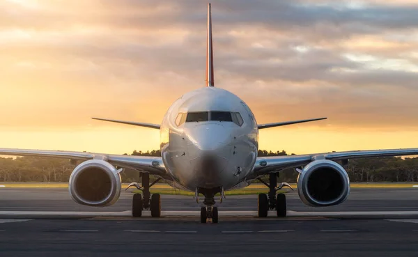 Airplane on Airport Runway at Sunset in Tasmania