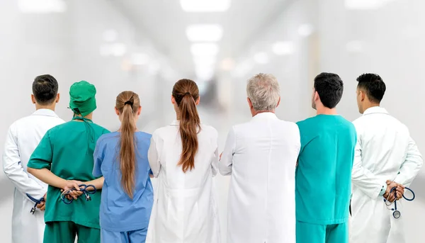 Healthcare profession teamwork and doctor service concept - International medical staff group of doctors, nurses and surgeon specialist standing with stethoscopes in the hospital.