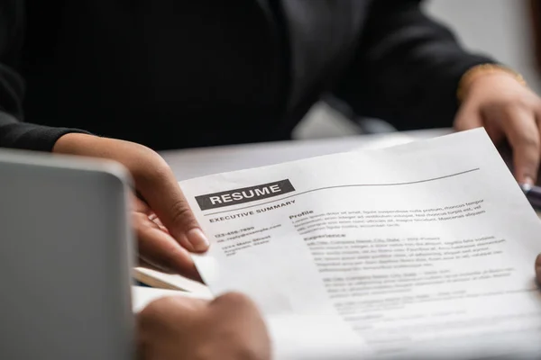 Candidate hands resume to the interviewer. — Stock Photo, Image