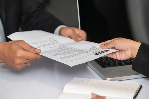 Candidate hands resume to the interviewer. — Stock Photo, Image