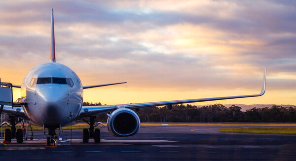 Airplane on Airport Runway at Sunset in Tasmania