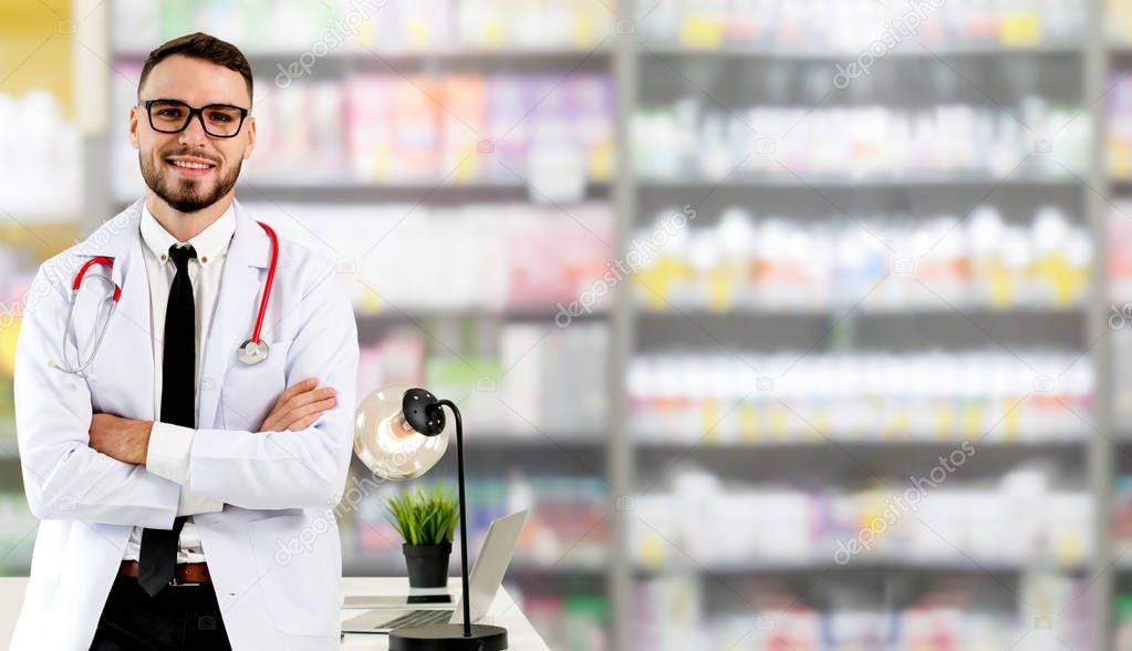 Pharmacist standing in pharmacy room.