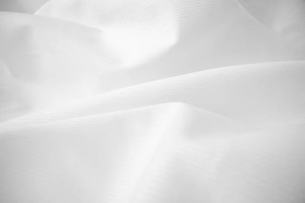Glanzend vloeiende doek textuur in macro shot. — Stockfoto