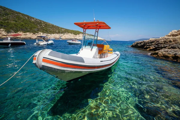 Motorboat on clear ocean water in Hvar, Croatia.