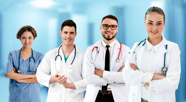 Doctor working in hospital with other doctors. — Stock Photo, Image