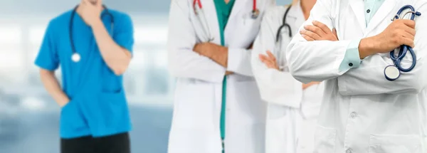 Doctor working in hospital with other doctors. — Stock Photo, Image