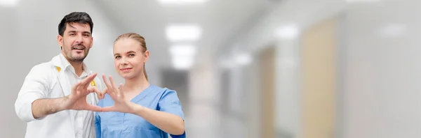 Doctors at hospital working with another doctor. — Stock Photo, Image