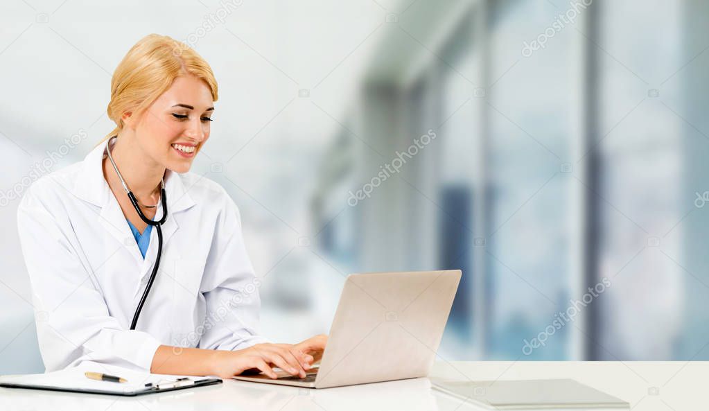 Doctor using laptop computer at the hospital.
