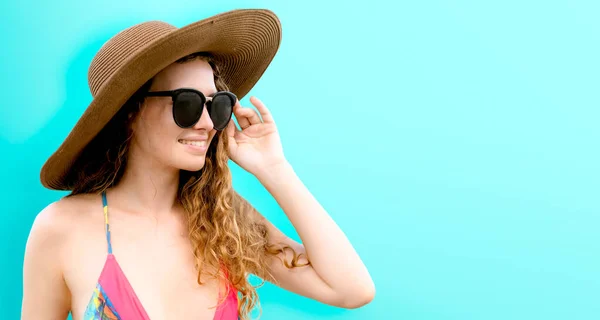 Woman in swimsuit posing on color background. — Stock Photo, Image