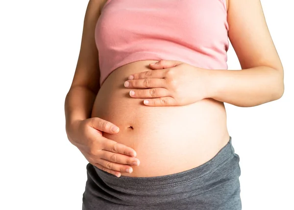 Mujer embarazada feliz aislada sobre fondo blanco . — Foto de Stock