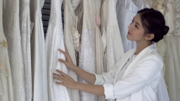 Future bride choosing wedding dress for her upcoming wedding cer — Stock Photo, Image