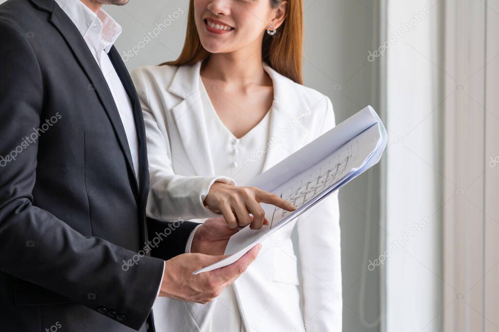 Businesswoman meeting with businessman in office.