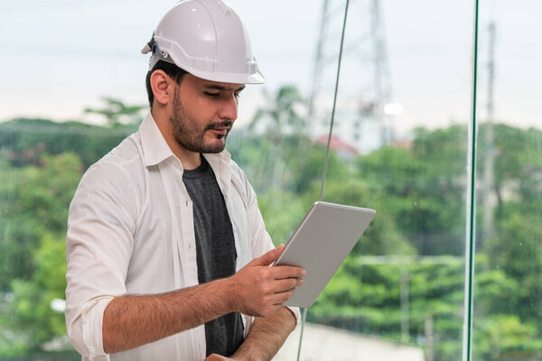 Young man architect or engineer in office