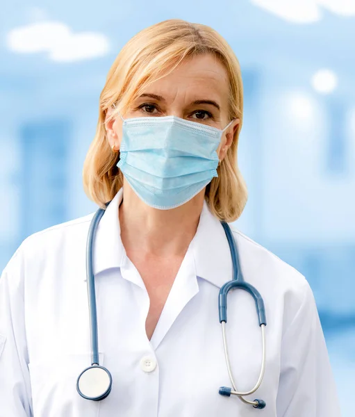 Doctor wear face mask in hospital protect from coronavirus disease or COVID-19. Medical staff are high risk people to receive infection from coronavirus disease or COVID-19.