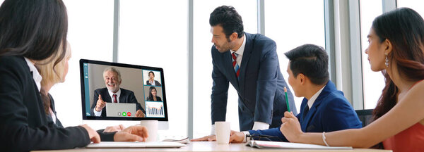 Video call group business people meeting on virtual workplace or remote office. Telework conference call using smart video technology to communicate colleague in professional corporate business.