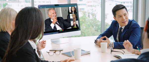 Video call group business people meeting on virtual workplace or remote office. Telework conference call using smart video technology to communicate colleague in professional corporate business.