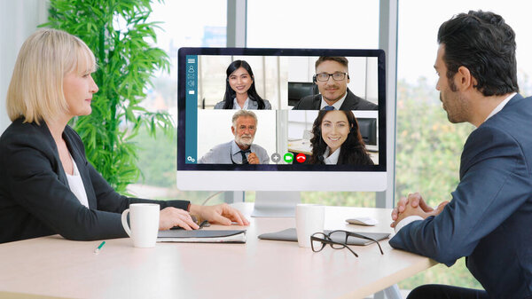 Video call group business people meeting on virtual workplace or remote office. Telework conference call using smart video technology to communicate colleague in professional corporate business.