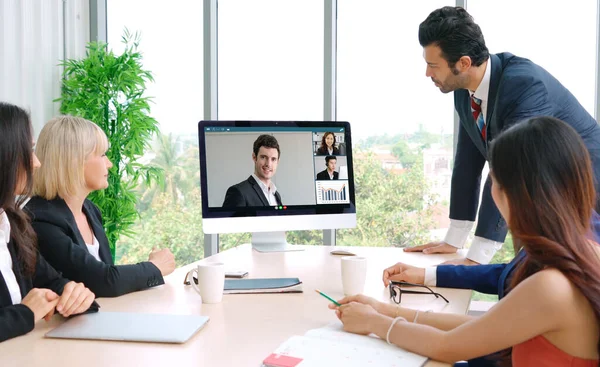 Video call group business people meeting on virtual workplace or remote office. Telework conference call using smart video technology to communicate colleague in professional corporate business.