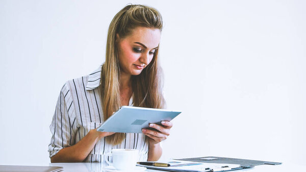 Blonde business woman working at modern office. Business concept.