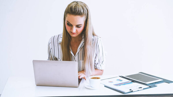 Blonde business woman working at modern office. Business concept.