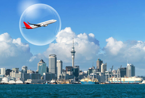 Travel bubble concept - Airplane traveling in bubble representing international travel bubble project to revive tourism and hotel industry among countries that show good control of covid 19 spreading.