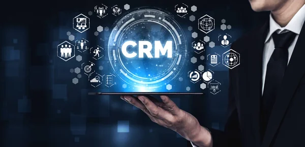 CRM Customer Relationship Management for business sales marketing system concept presented in futuristic graphic interface of service application to support CRM database analysis.