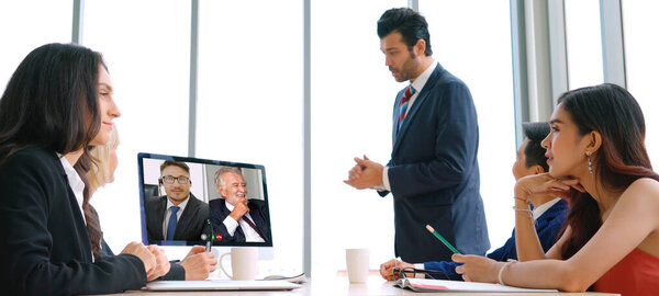 Video call group business people meeting on virtual workplace or remote office. Telework conference call using smart video technology to communicate colleague in professional corporate business.