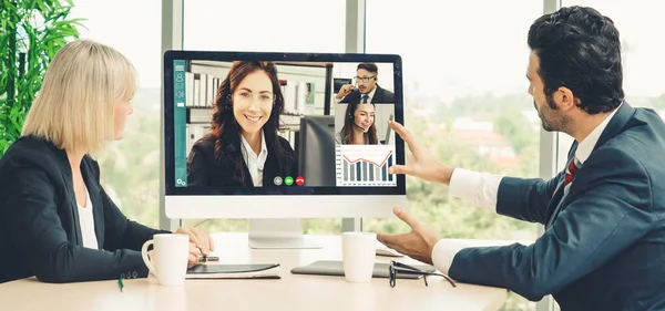 Video call group business people meeting on virtual workplace or remote office. Telework conference call using smart video technology to communicate colleague in professional corporate business.