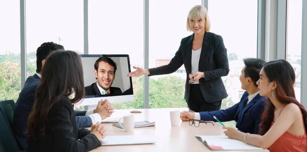 Video call group business people meeting on virtual workplace or remote office. Telework conference call using smart video technology to communicate colleague in professional corporate business.