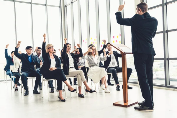 Group of business people meeting in a seminar conference . Audience listening to instructor in employee education training session . Office worker community summit forum with expert speaker . — Stock Image Group Business People Meeting Seminar Conference Audience Listening Instructor Employee Stock Photo