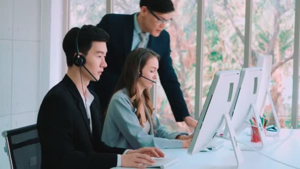 Business people wearing headset working in office — Stock Video