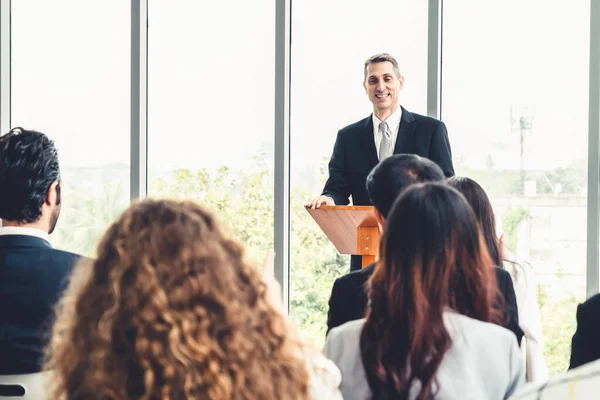 Group of business people meeting in a seminar conference