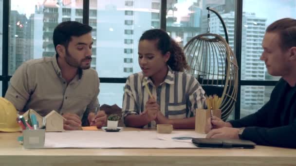 Creative business people group having a conversation at office desk in workplace. — Stock video