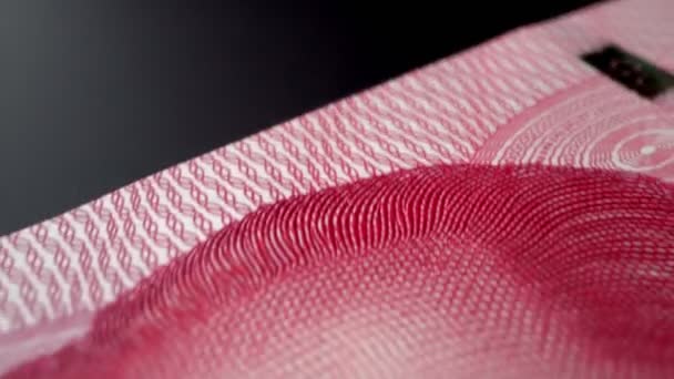 Cent billets en papier Yuan chinois en gros plan vue macro dolly shot.