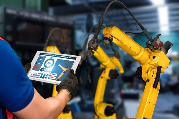 Smart industry robot arms for digital factory production technology showing automation manufacturing process of the Industry 4.0 or 4th industrial revolution and IOT software to control operation .