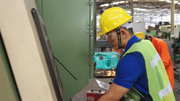 Smart factory worker using machine in factory workshop . Industry and engineering concept.