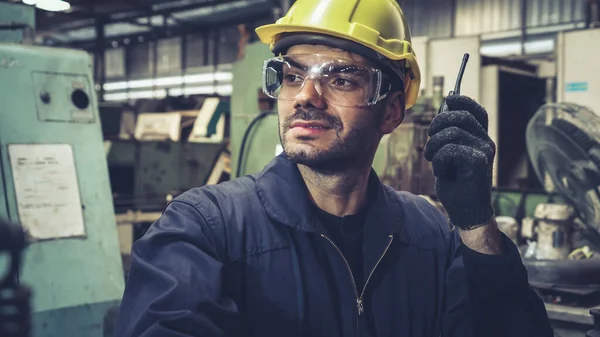 Factory Worker Talking Portable Radio While Inspecting Machinery Parts Industrial — Stock Photo, Image
